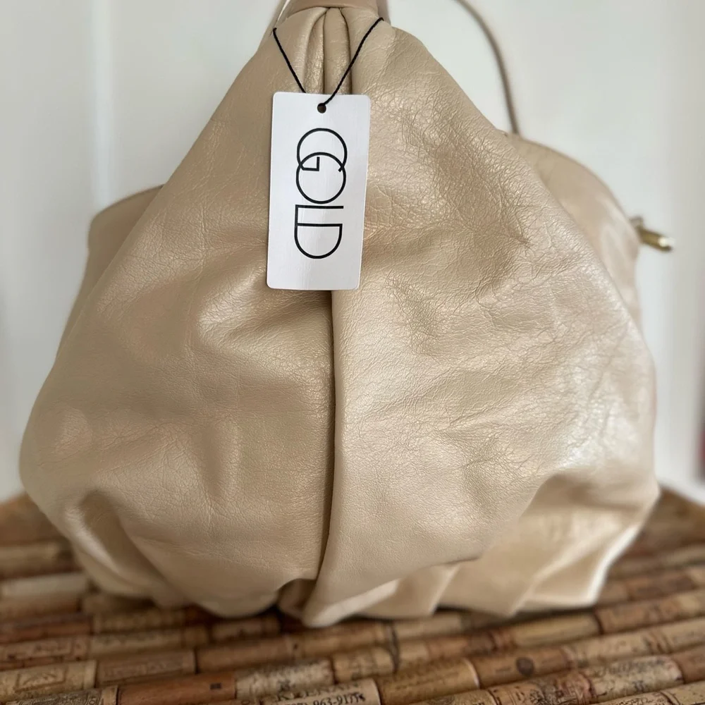 NWT gorgeous gold leather handbag. Detachable shoulder strap. Gold and beige